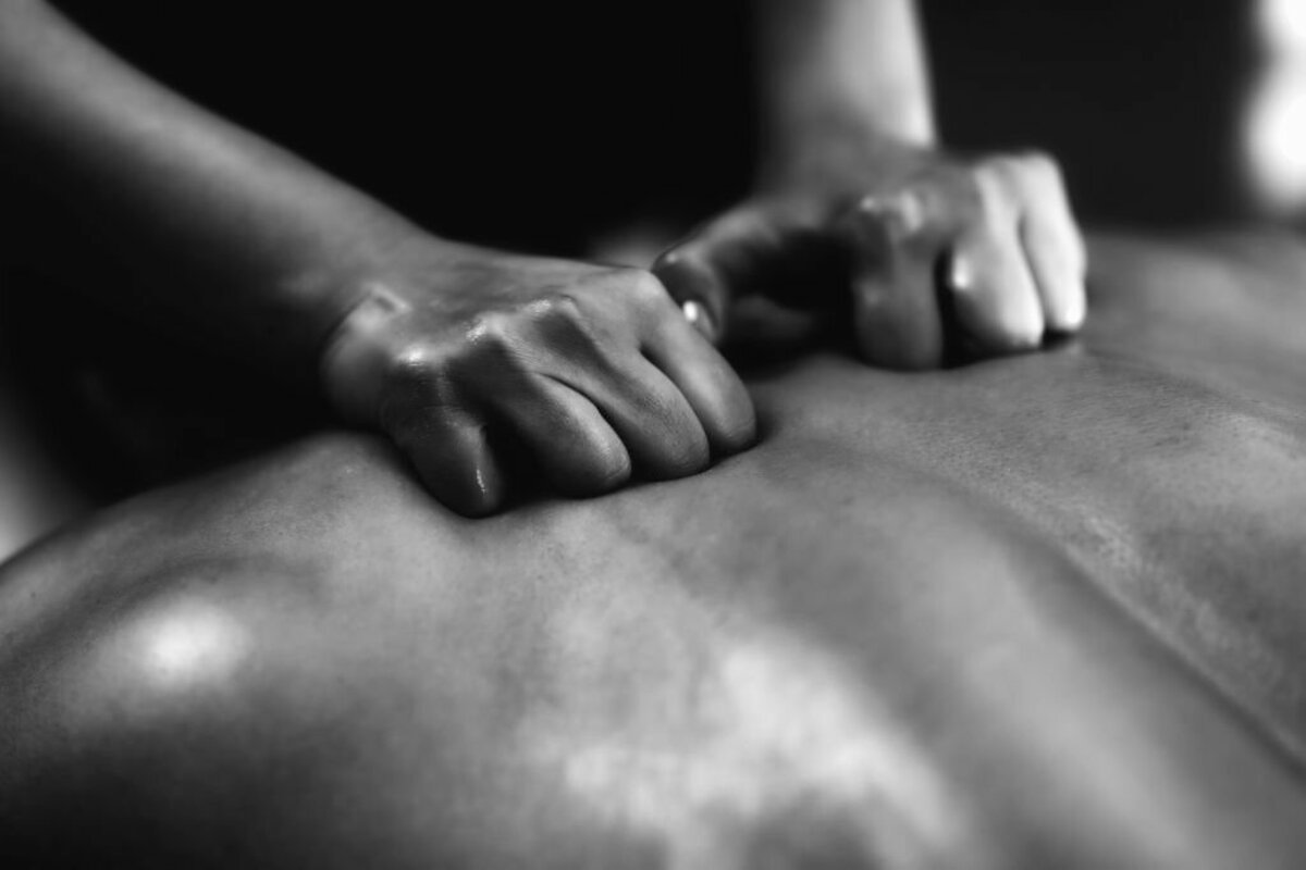 Warm oil prepared for an outcall massage session